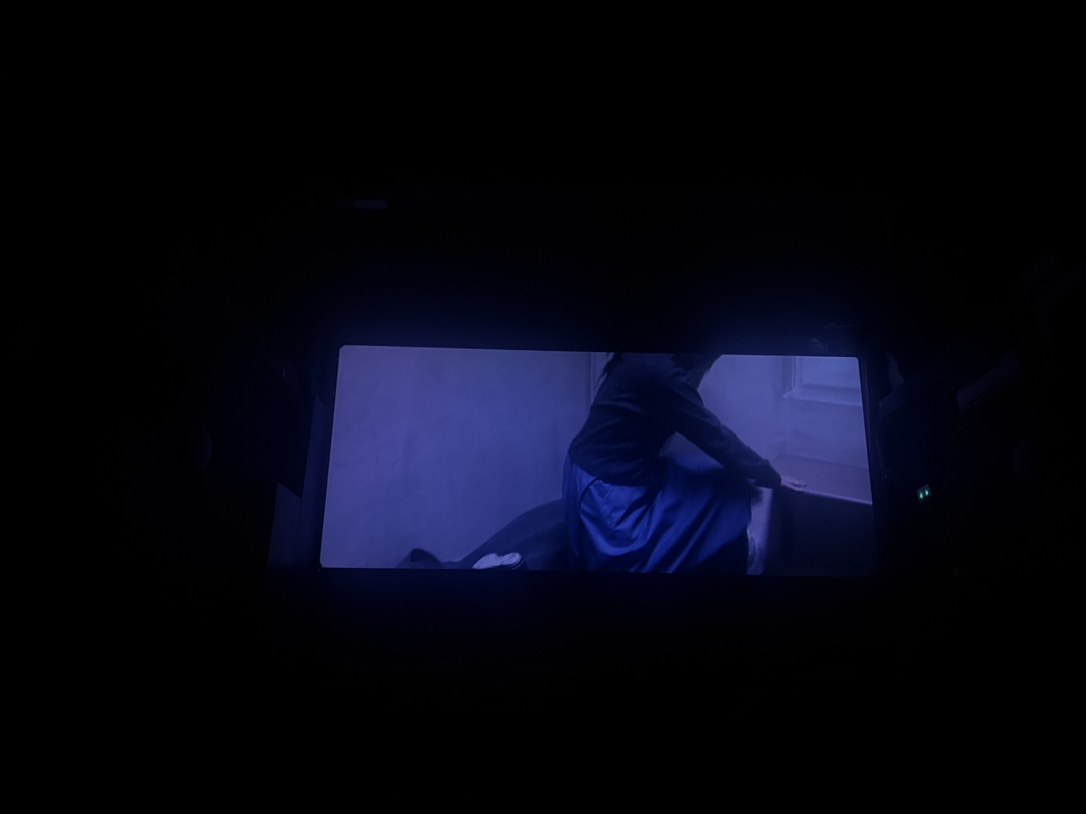 Blue-lit cinema screen photographed during Dancer in the Dark